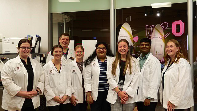 A group of researchers in Ohio State University lab coats